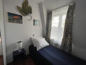 Uma cama ou camas num quarto em Blue Marina Gdańsk