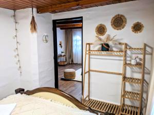 a bedroom with a bed and a mirror at Tokaj Zlatá Putňa - Restaurant & Pension in Viničky