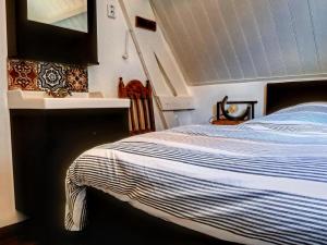 מיטה או מיטות בחדר ב-Cozy holiday home in a quiet area