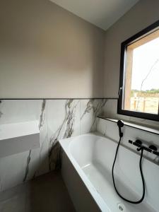 Postel nebo postele na pokoji v ubytování Le Petit Hôtel de Pianottoli-Caldarello