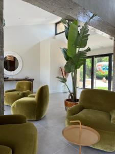 Posezení v ubytování Le Petit Hôtel de Pianottoli-Caldarello
