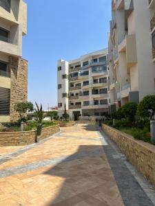 a walkway in front of a building at CHIC & COZY appartement très calme in Casablanca