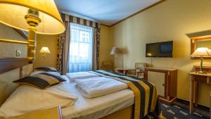 Postel nebo postele na pokoji v ubytování Hotel Richard Spa & Wellness