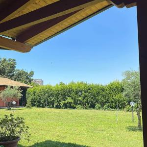 a view of a yard with a grass field at Locanda il Fienile in Naples