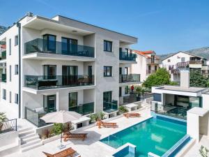 an aerial view of a building with a swimming pool at Luxury Apartments Villa MTG in Orebić