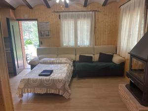 a living room with a couch and a table at Casa Rural Riópar, luxury in nature in Riópar