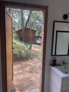 a door to a yard with a view of a backyard at Casa Rural Riópar, luxury in nature in Riópar