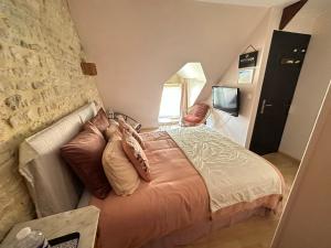 Letto o letti in una camera di Chambres d’hôtes de l’Ancienne Auberge