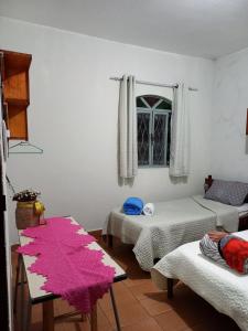 Postel nebo postele na pokoji v ubytování Casa em Diamantina