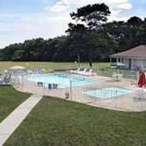 a large swimming pool in the middle of a yard at Oceanside Lodge in Marmora