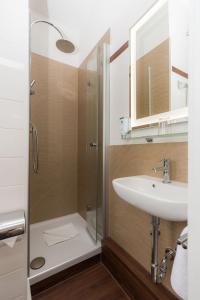 a bathroom with a shower and a sink at Hotel Fürst Bismarck in Hamburg