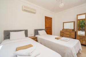 A bed or beds in a room at Villa Asya 2