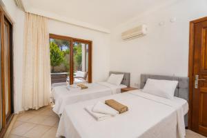 A bed or beds in a room at Villa Asya 2