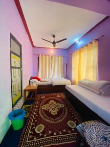 Voodi või voodid majutusasutuse Himchuli Guest House toas