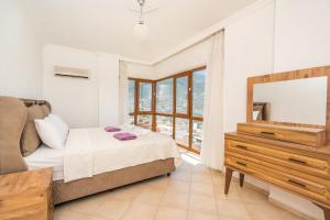 A bed or beds in a room at Villa Asya 2