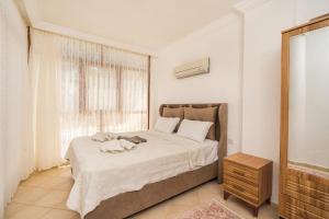 A bed or beds in a room at Villa Asya 2