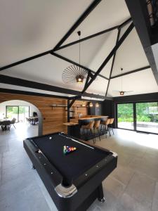 a pool table in the middle of a room at Cocquea in Francorchamps