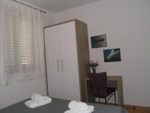 Posteľ alebo postele v izbe v ubytovaní Momentum Apartment