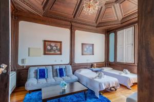 a living room with a couch and a table at Palacio Nova Seara 2503 - AL in Armamar