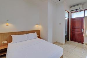 Postel nebo postele na pokoji v ubytování Guest House Simalem
