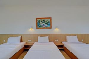 Postel nebo postele na pokoji v ubytování Guest House Simalem