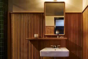 a bathroom with a sink and a mirror at Freehand New York in New York