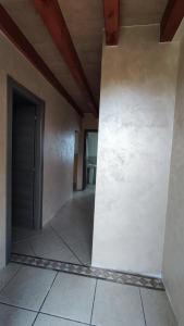 an empty hallway of a house with a door at Albergo Le Piante in Manerba del Garda