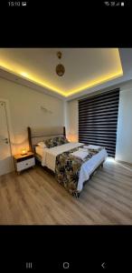 a bedroom with a large bed in a room at Lilyum in Dalaman