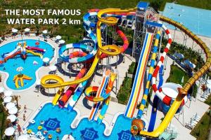 a water park with a roller coaster and a water park at Dumlupınar Royal Rooms in Antalya