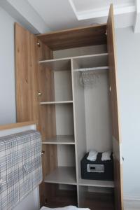 a room with a closet with wooden shelves at Dolce Bella Suites in Trabzon +31 photos