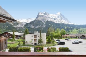 a view of a parking lot with a mountain at Chalet Eigersunna in Grindelwald