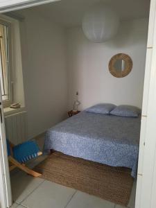 Ένα ή περισσότερα κρεβάτια σε δωμάτιο στο Appartement T2 avec jardin privatif 3 étoiles