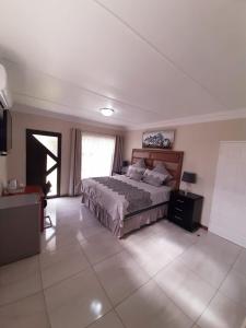 A bed or beds in a room at Masechaba guesthouse