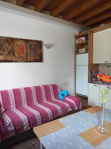 a living room with a couch and a table at B&b del bosco e del lago Elimar in Lecco