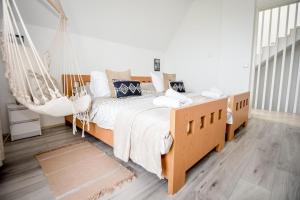 Posteľ alebo postele v izbe v ubytovaní Apartamenty Dwupoziomowe Na Dwa Widoki z Jacuzzi & Sauna