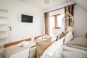 Posteľ alebo postele v izbe v ubytovaní Apartamenty Dwupoziomowe Na Dwa Widoki z Jacuzzi & Sauna
