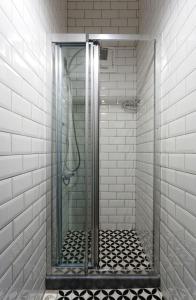 a shower with a glass door in a bathroom at Cheers Porthouse in Istanbul