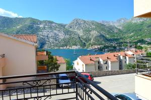 a view of a body of water from a balcony at Apartments Risan Club Family in Risan