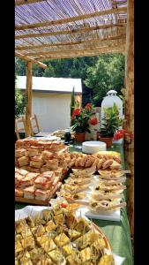 a buffet of sandwiches and pastries on a table at AgriGlamping La Diaccia in Serravalle Pistoiese