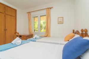 Postel nebo postele na pokoji v ubytování Casa Aina
