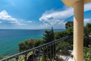 a balcony with a view of the ocean at Villa Mare Crikvenica in Crikvenica