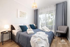 Postel nebo postele na pokoji v ubytování Apartament River Side-basen,jacuzzi,sauna,siłownia-Marina Dziwnów-SANNEL Apartments for rent + 34 fotografií
