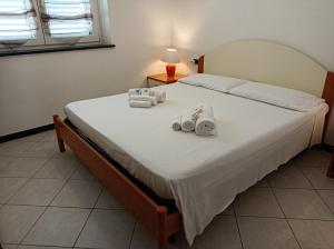Postel nebo postele na pokoji v ubytování CasaGiulia Calasetta