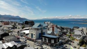 an aerial view of a city with the ocean at Alto Andino Hotel in Ushuaia