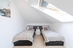 Кровать или кровати в номере Apartament Półwysep Dziwnów Premium by Major Domus Club