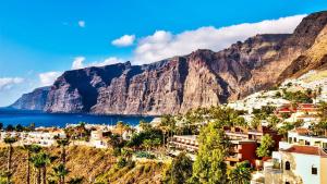 a view of a town on a hill with mountains at Big Room Tenerife Sur Private Bathroom Wifi in Arona