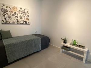 a small bedroom with a bed and a table at Villa Demi-Adore in Mazarrón +51 photos