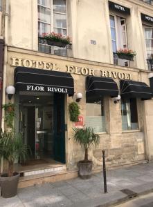 a store front of a building with an awning at Hôtel Flor Rivoli in Paris