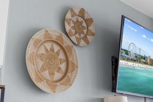 two plates hanging on a wall with the beach at Direct OCEANFRONT- King Bedroom- AMAZING VIEWS/Pools/Hot Tubs/Beach Access/Golf in Myrtle Beach