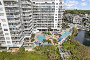 an aerial view of a resort with a swimming pool at Direct OCEANFRONT- King Bedroom- AMAZING VIEWS/Pools/Hot Tubs/Beach Access/Golf in Myrtle Beach